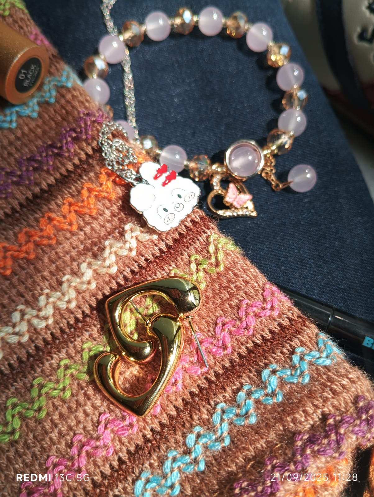 The gold toned curved hoop