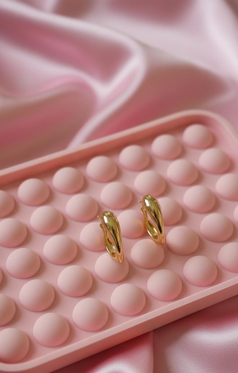 The gold toned curved hoop