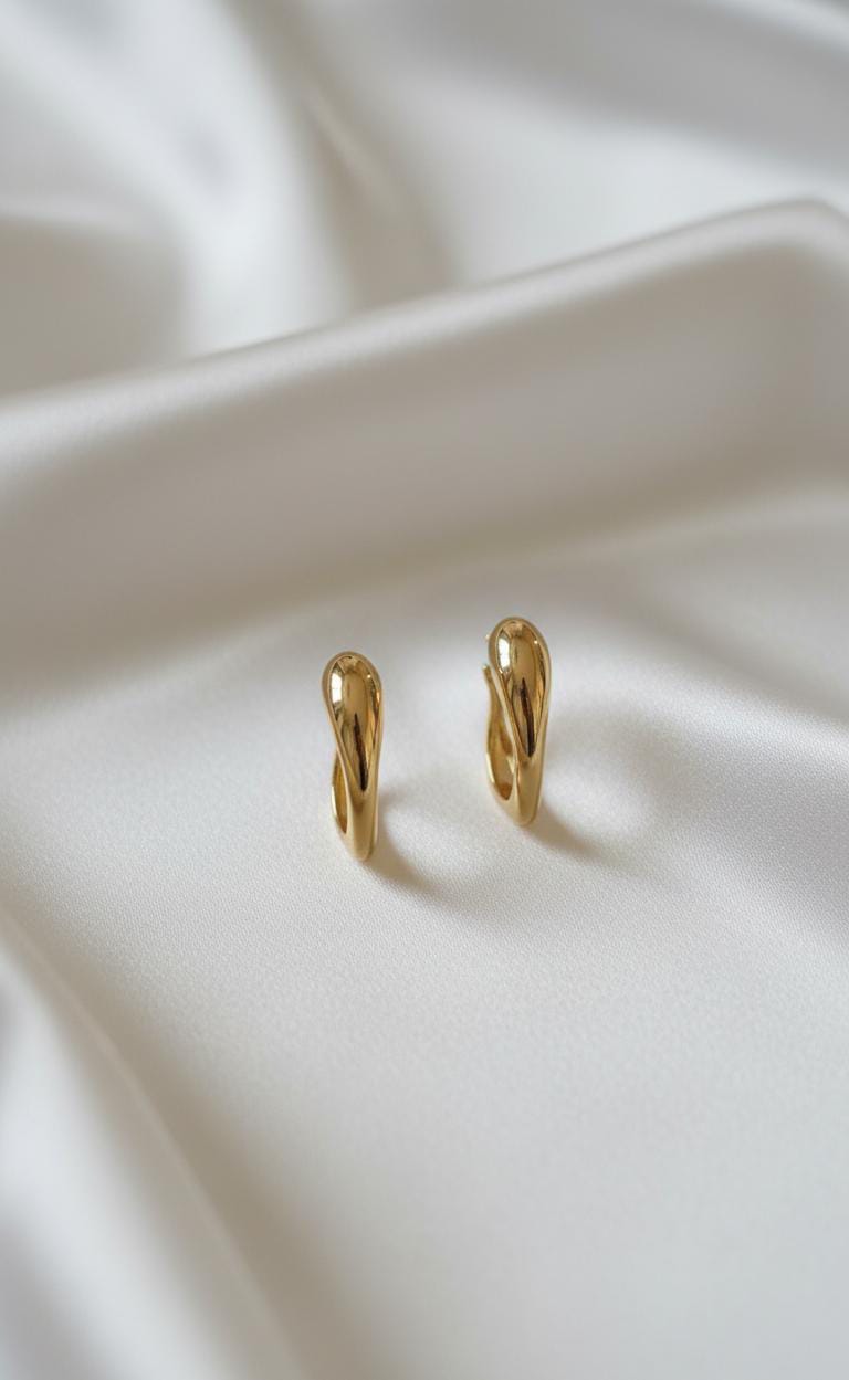 The gold toned curved hoop