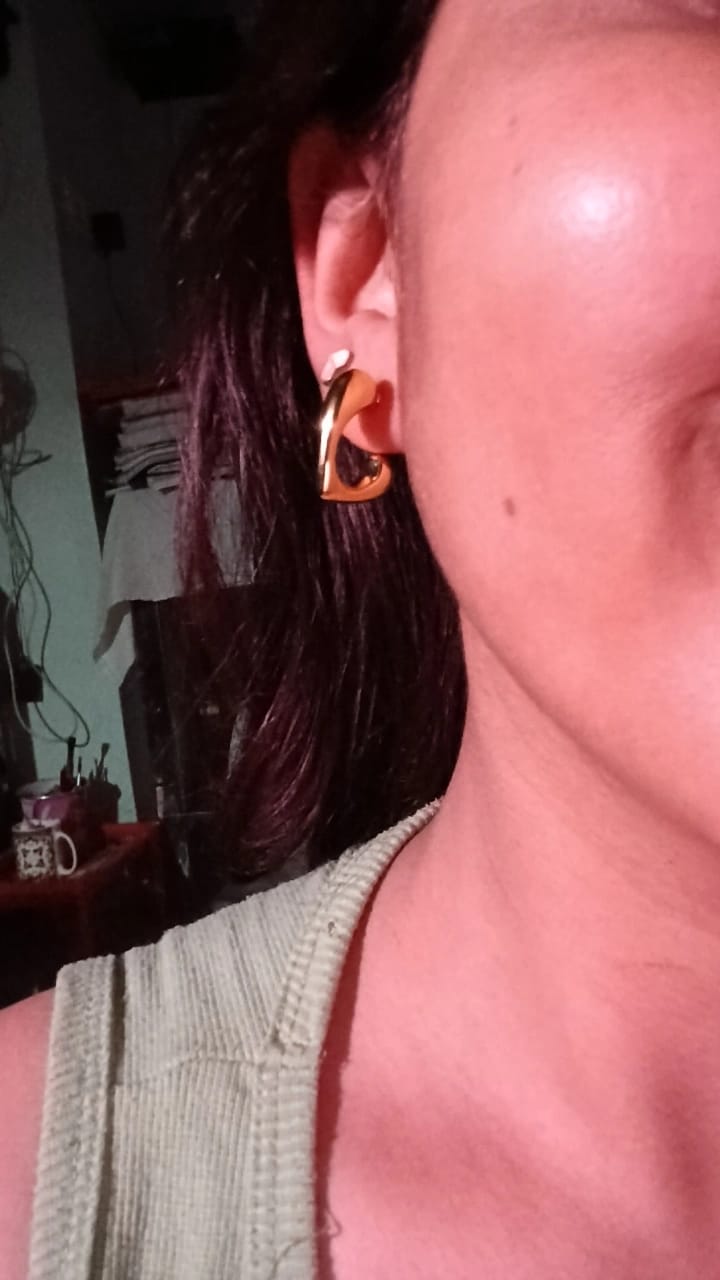 The gold toned curved hoop